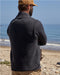 The back of a man wearing a black wool vest
